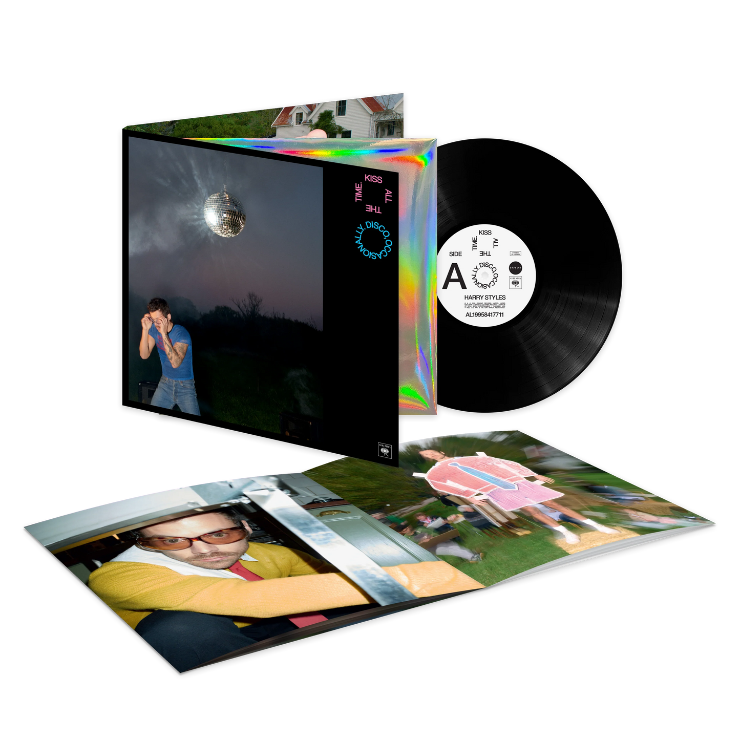 Harry Styles official merch black vinyl record packshot with holographic sleeve and collectible insert artwork.